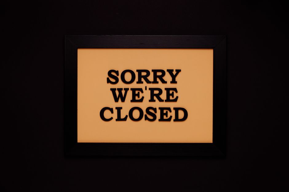 Black-framed 'Sorry We're Closed' sign against a dark backdrop, ideal for business themes.